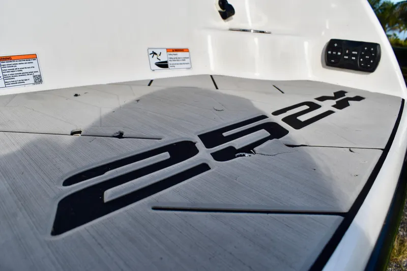 Slide: The Image of 2022 Yamaha Boats 252XE interior with sleek design, modern dashboard, and comfortable seating. - 20