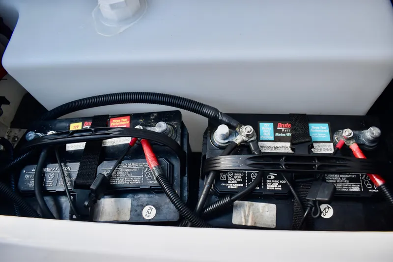 Slide: The Image of Batteries in a 2022 Yamaha Boats 252XE, showcasing marine power setup. - 35
