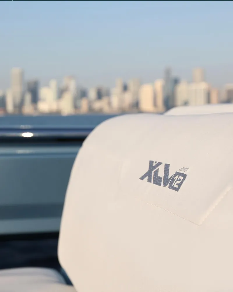 Slide: The Image of 2023 Limitless Seas XLV boat seat with city skyline in background. - 16