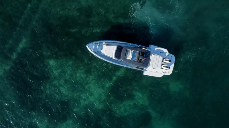 Slide: The Image of Aerial view of 2023 Limitless Seas XLV yacht on clear blue water. - 4
