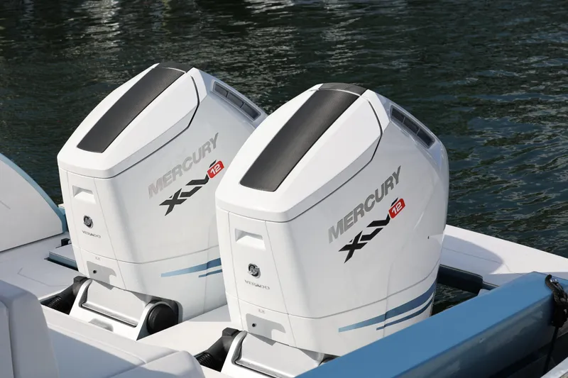 Slide: The Image of 2023 Limitless Seas XLV boat with dual Mercury outboard engines on water. - 5
