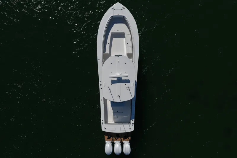 Slide: The Image of Aerial view of 2024 Regulator 34 boat on dark water. - 21