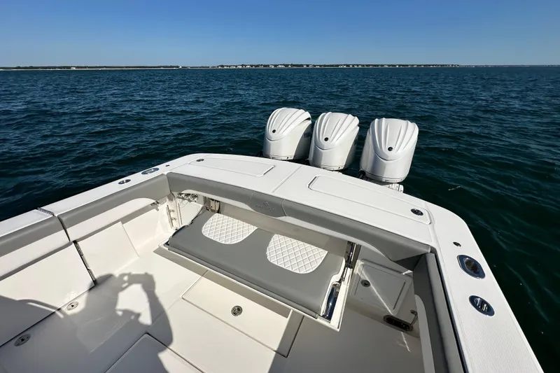 Slide: The Image of 2024 Regulator 34 boat with triple engines on open water. - 24