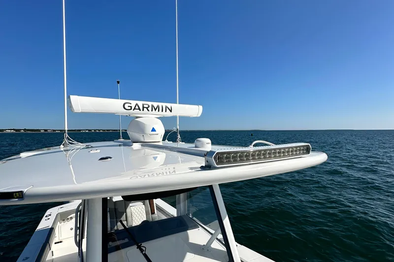 Slide: The Image of 2024 Regulator 34 boat with Garmin radar on open water. - 31