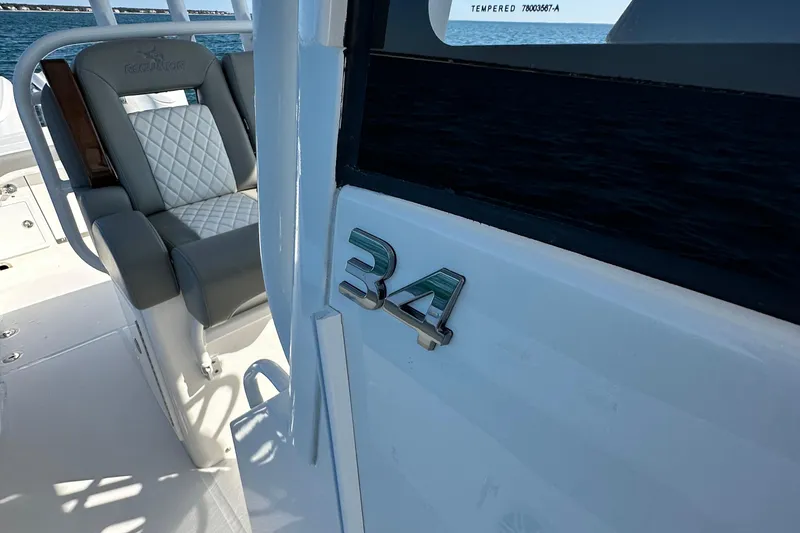 Slide: The Image of 2024 Regulator 34 boat interior with luxury seating and model emblem. - 35