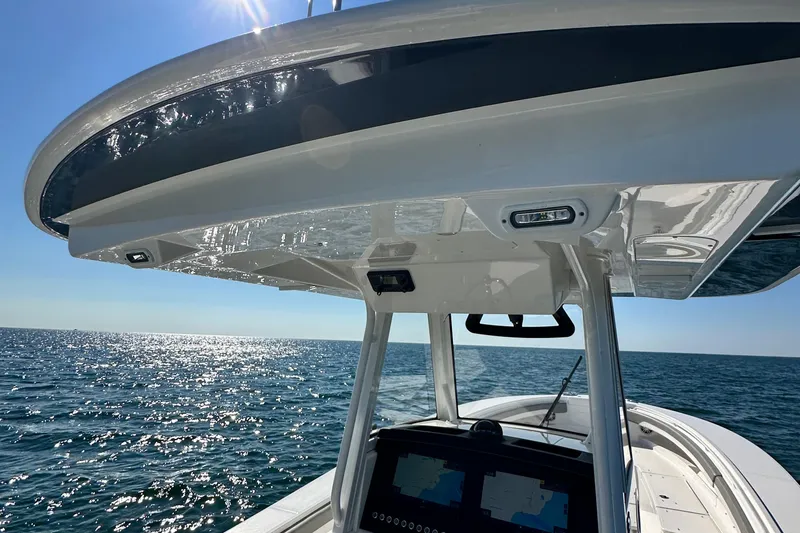 Slide: The Image of 2024 Regulator 34 boat on open sea, featuring sleek design and advanced navigation system. - 39