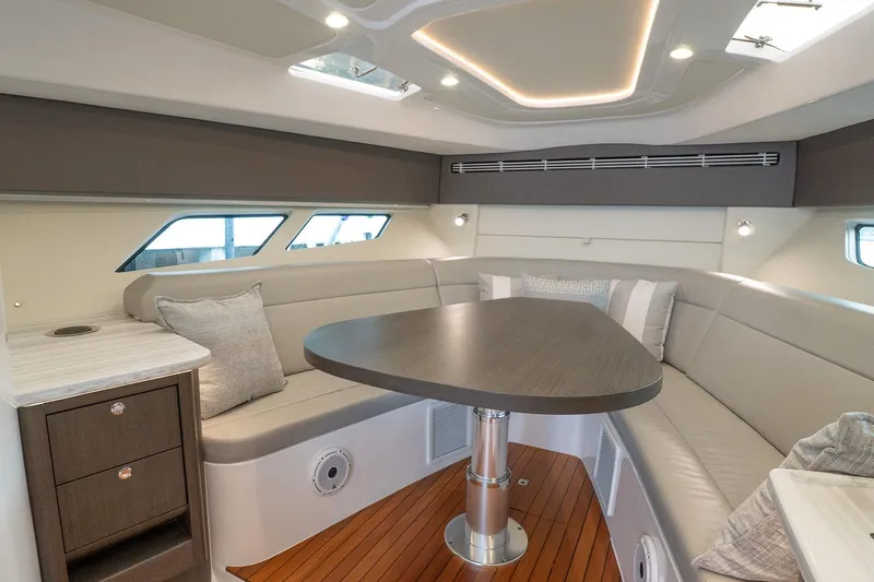 Slide: The Image of Luxurious interior of 2022 Intrepid 477 Evolution yacht with elegant seating and modern design. - 16