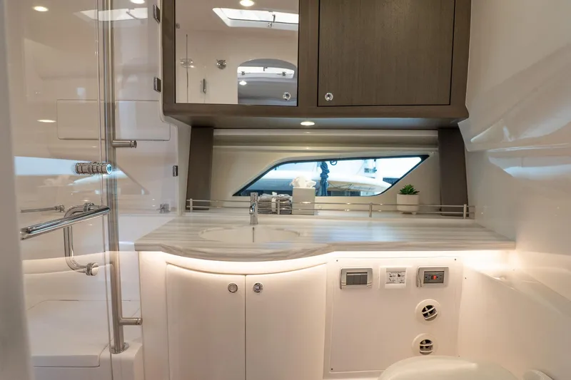 Slide: The Image of Luxurious bathroom interior of 2022 Intrepid 477 Evolution yacht, featuring modern fixtures and cabinetry. - 20