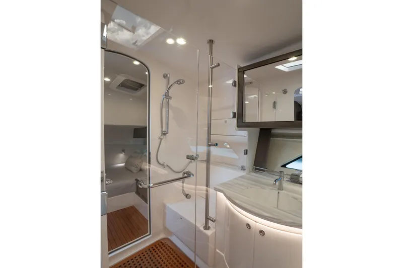 Slide: The Image of Luxurious bathroom interior of 2022 Intrepid 477 Evolution yacht, featuring modern shower and sink. - 21