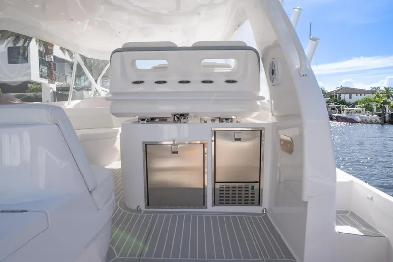 Slide: The Image of 2022 Intrepid 477 Evolution yacht interior with modern amenities and sleek design. - 9