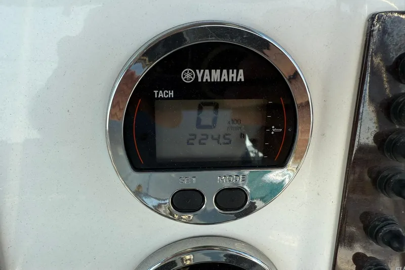 Slide: The Image of Yamaha tachometer on 2017 Robalo R222ES boat dashboard, displaying 224.5 hours. - 13