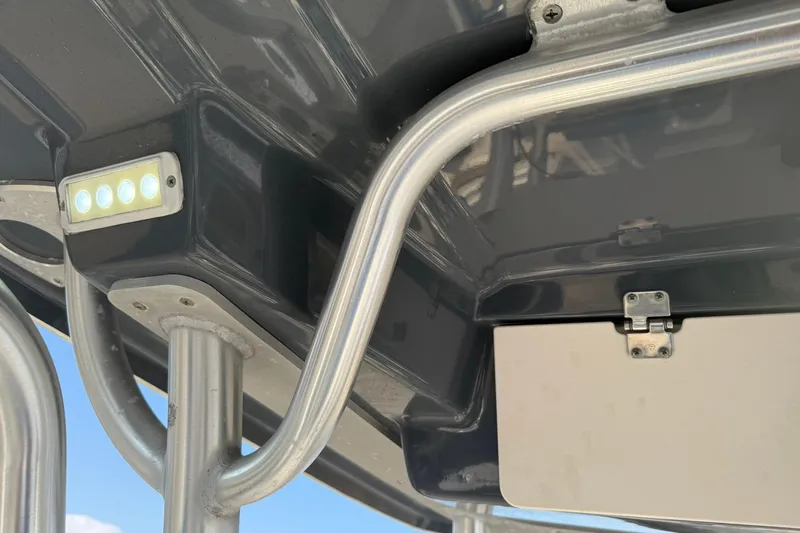 Slide: The Image of 2017 Robalo R222ES boat T-top with LED lights and stainless steel frame. - 15