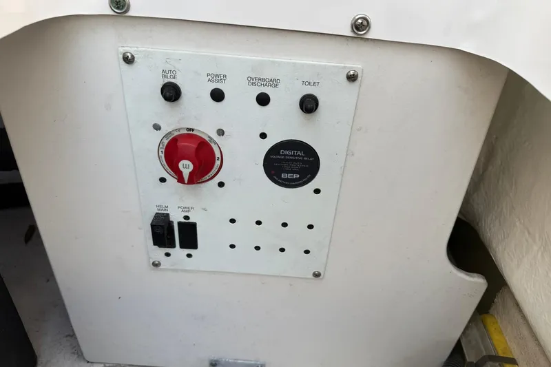 Slide: The Image of Control panel of a 2017 Robalo R222ES boat with various switches and dials. - 20