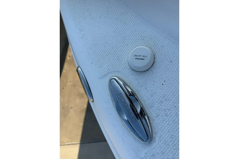 Slide: The Image of 2017 Robalo R222ES boat detail with SiriusXM antenna and chrome logo. - 22