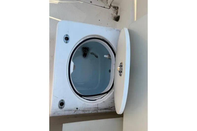 Slide: The Image of Open storage compartment on 2017 Robalo R222ES boat. - 24