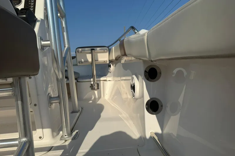 Slide: The Image of 2017 Robalo R222ES boat interior with seating and stainless steel railings. - 26