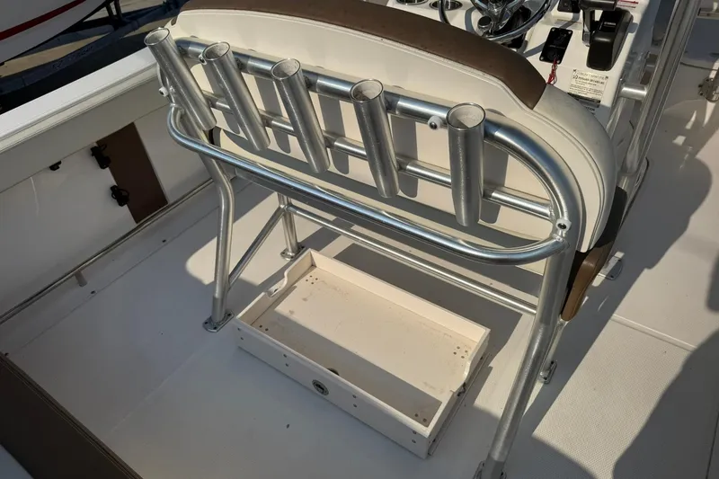 Slide: The Image of 2017 Robalo R222ES boat interior with rod holders and steering console. - 28