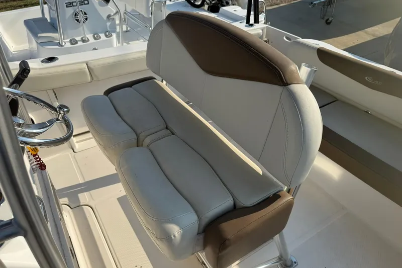 Slide: The Image of 2017 Robalo R222ES boat interior with dual-tone seating and steering wheel. - 3