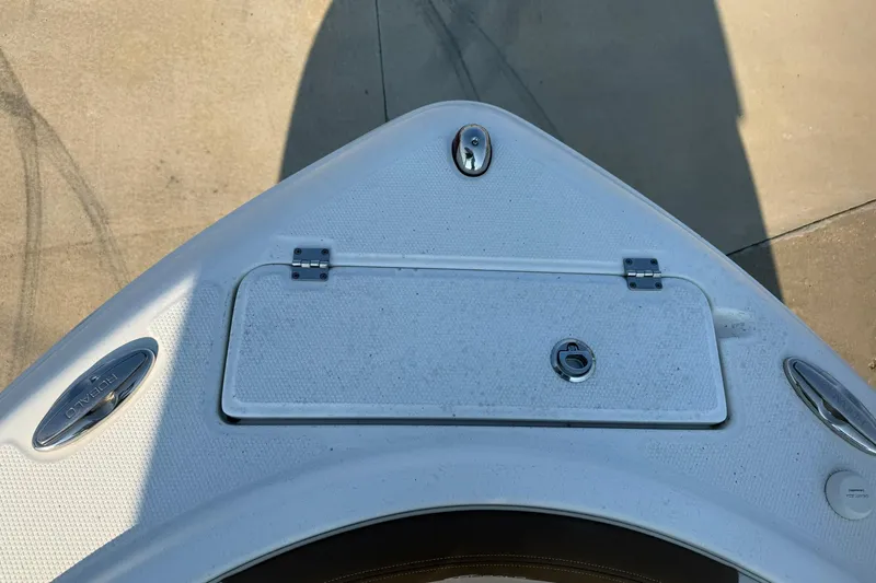Slide: The Image of 2017 Robalo R222ES boat bow with storage hatch and cleat. - 30