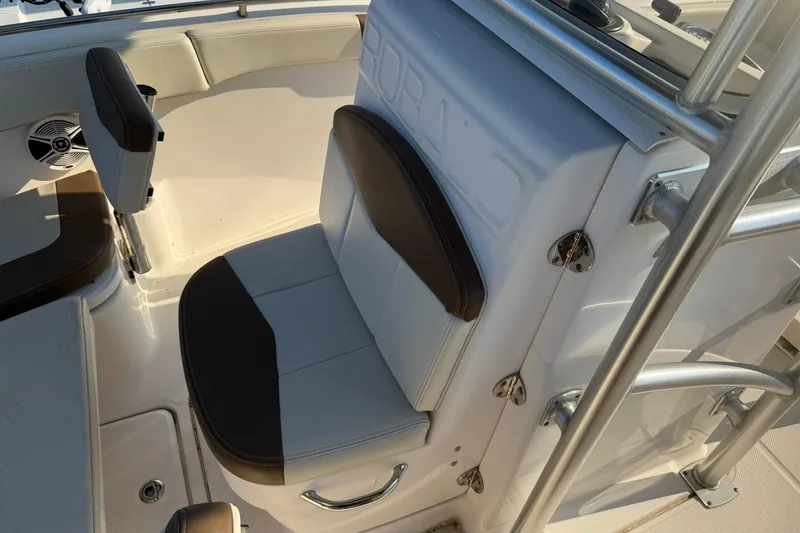 Slide: The Image of 2017 Robalo R222ES boat interior with cushioned seating and stainless steel railings. - 5