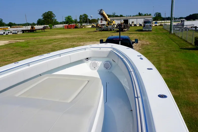 Slide: The Image of 2022 Contender 39 Fisharound boat with triple Yamaha engines on open water. - 11