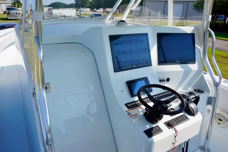 Slide: The Image of 2022 Contender 39 Fisharound boat with luxurious seating on a sunny day at sea. - 12