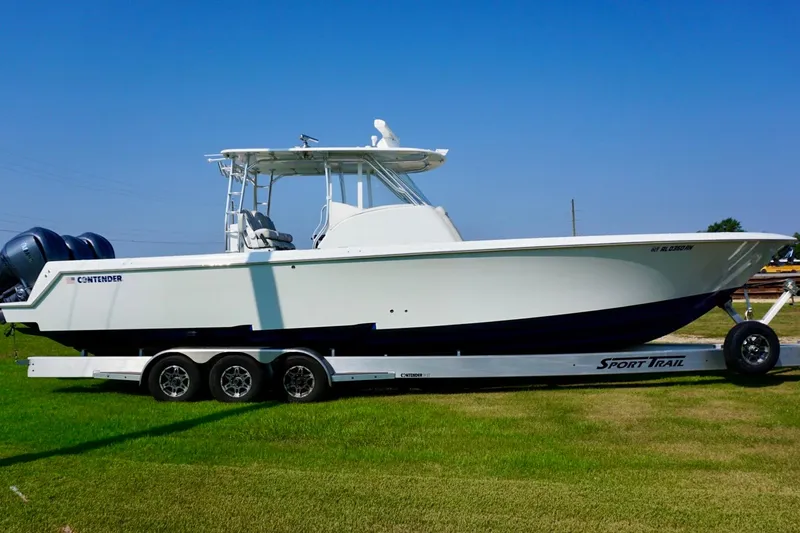 Slide: The Image of 2022 Contender 39 Fisharound boat on open water, featuring dual outboard motors. - 3