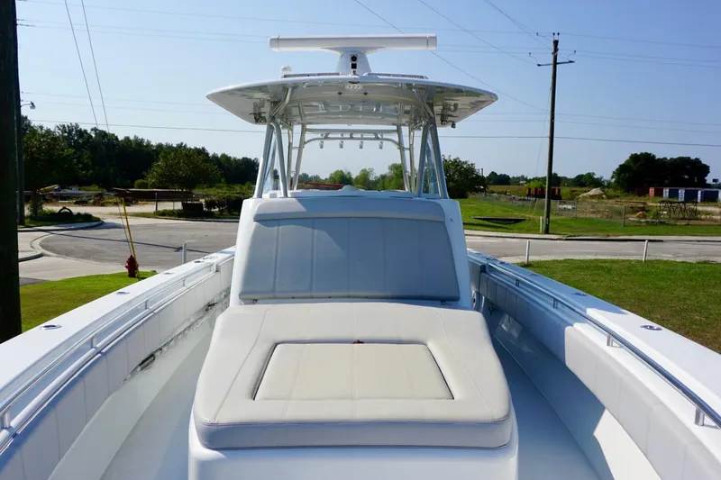 Slide: The Image of 2022 Contender 39 Fisharound boat cruising on clear blue water. - 9