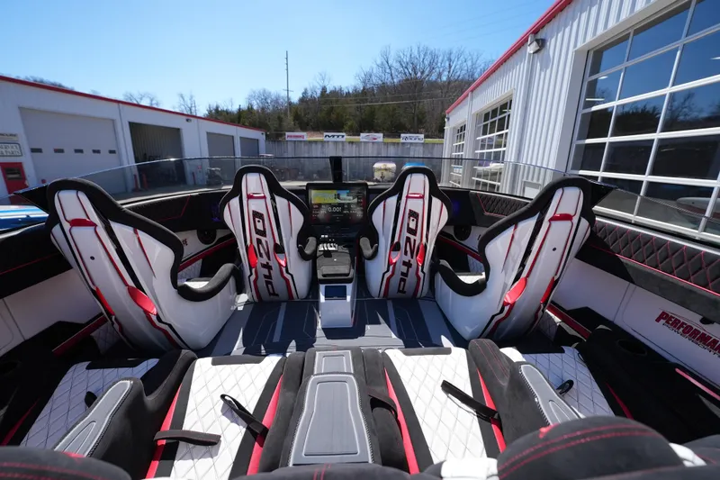 Slide: The Image of Interior of 2025 Performance Powerboats P420 with stylish red and white racing seats. - 11