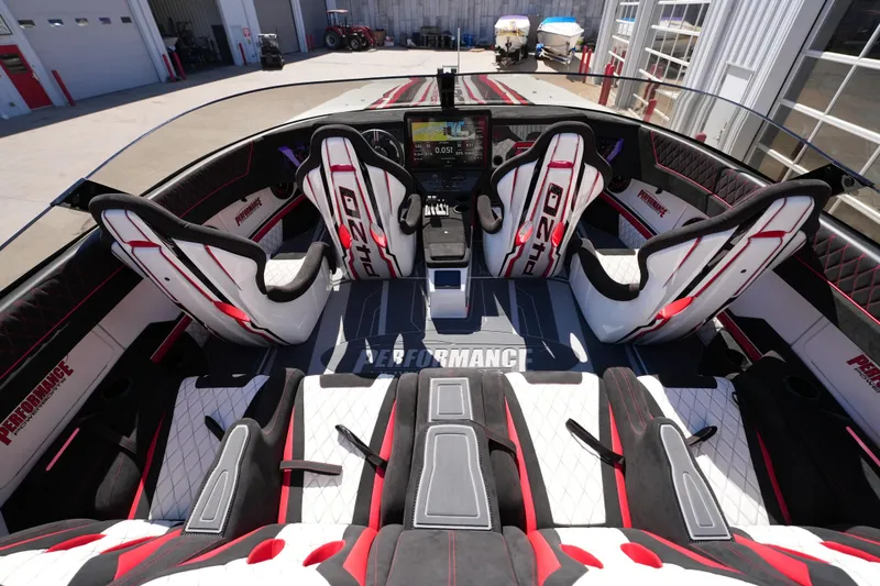 Slide: The Image of Interior of 2025 Performance Powerboats P420 with stylish red and white seating. - 12