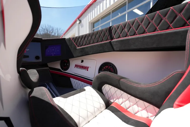 Slide: The Image of 2025 Performance Powerboats P420 interior with stylish seating and audio system. - 18