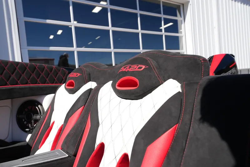 Slide: The Image of 2025 Performance Powerboats P420 interior with red and white luxury seating. - 28