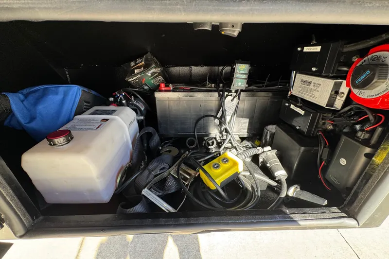 Slide: The Image of Storage compartment of a 2025 Performance Powerboats P420, featuring various equipment and cables. - 32