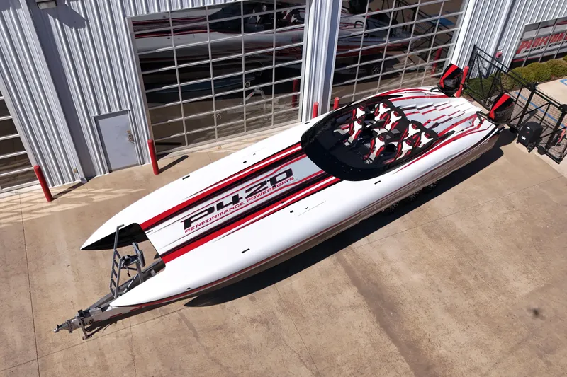 Slide: The Image of 2025 Performance Powerboats P420 on a trailer, showcased outdoors under a clear blue sky. - 4