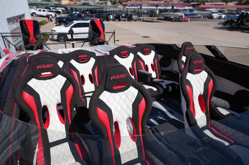 Slide: The Image of 2025 Performance Powerboats P420, sleek design, parked outside a modern building. - 6