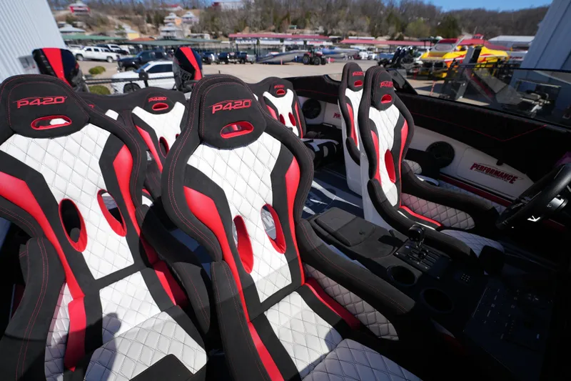 Slide: The Image of 2025 Performance Powerboats P420 interior with red, black, and white racing seats. - 9