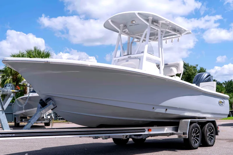 The Image of 2026 Sea Hunt BX 22 BR boat on trailer under blue sky. - 0