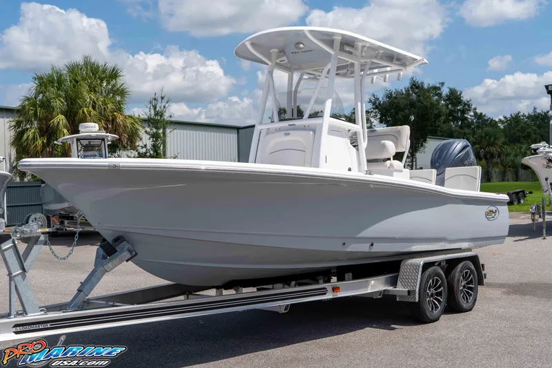 Slide: The Image of 2026 Sea Hunt BX 22 BR boat on trailer, parked outdoors under a clear sky. - 1