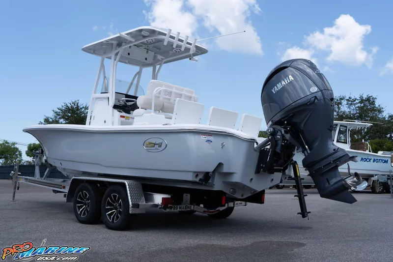 Slide: The Image of 2026 Sea Hunt BX 22 BR boat with Yamaha outboard motor on trailer. - 14