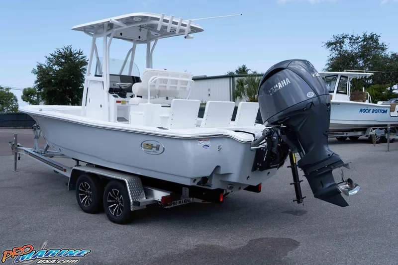 Slide: The Image of 2026 Sea Hunt BX 22 BR boat on trailer with Yamaha outboard motor. - 16
