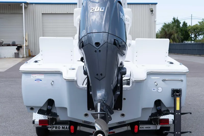 Slide: The Image of 2026 Sea Hunt BX 22 BR boat with Yamaha 200 engine, parked outdoors. - 18
