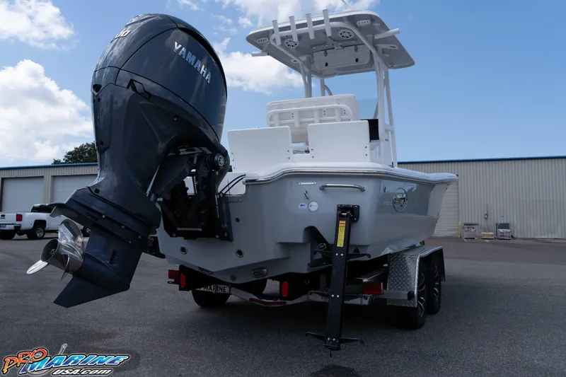 Slide: The Image of 2026 Sea Hunt BX 22 BR boat with Yamaha engine on trailer, parked outdoors. - 20