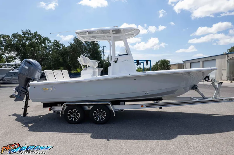 Slide: The Image of 2026 Sea Hunt BX 22 BR boat on trailer, featuring Yamaha outboard motor. - 21