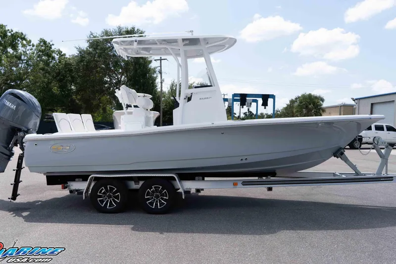 Slide: The Image of 2026 Sea Hunt BX 22 BR boat on trailer, side view, outdoors, clear sky. - 28