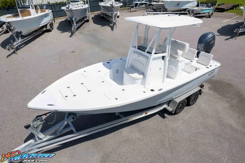 Slide: The Image of 2026 Sea Hunt BX 22 BR boat on trailer, parked in a marina lot. - 3