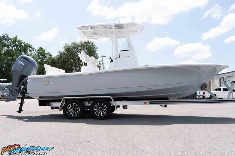 Slide: The Image of 2026 Sea Hunt BX 22 BR boat on trailer, featuring Yamaha outboard motor. - 30