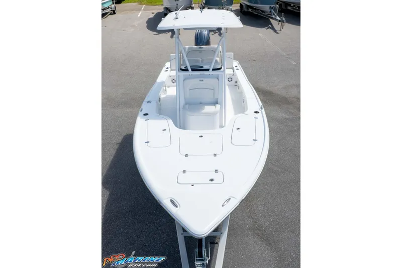 Slide: The Image of 2026 Sea Hunt BX 22 BR boat, white exterior, parked on a trailer in a lot. - 37