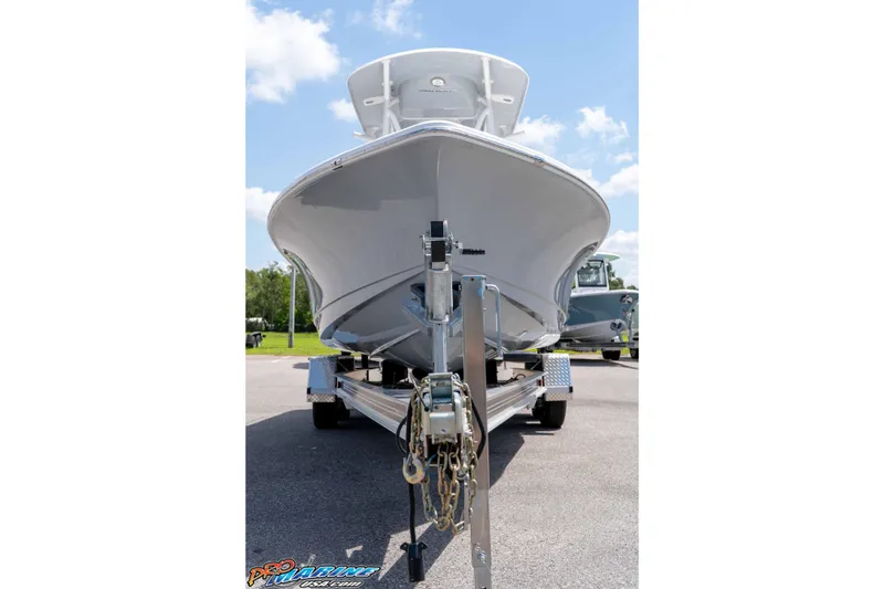 Slide: The Image of 2026 Sea Hunt BX 22 BR boat on trailer, viewed from the front under a clear sky. - 4