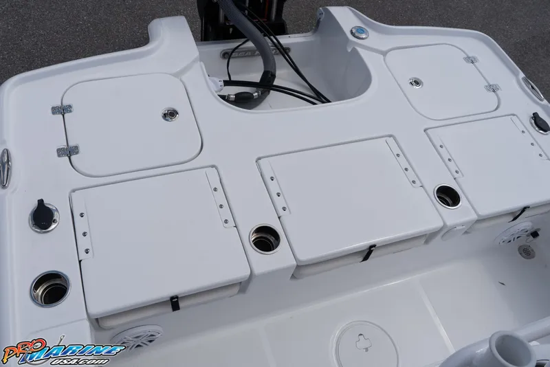 Slide: The Image of 2026 Sea Hunt BX 22 BR boat deck with storage compartments and cup holders. - 41