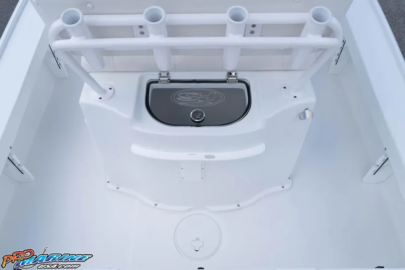 Slide: The Image of 2026 Sea Hunt BX 22 BR boat interior with rod holders and storage compartment. - 43